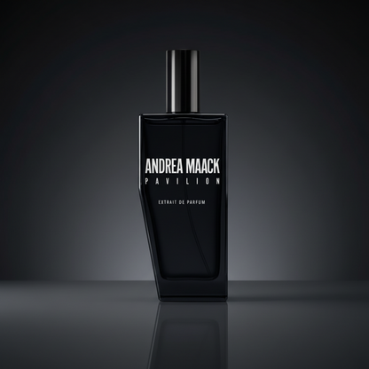 Black perfume bottle with 'Andrea Maack' branding on a white background