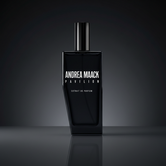 Black perfume bottle with 'Andrea Maack' branding on a white background